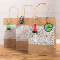 three brown paper bags with map tags on them