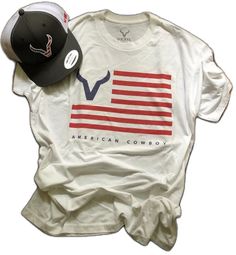 Vexil Brand " American" T-Shirt -Short Sleeve - White Shirt - Red and Blue Flag Vexil Logo American Cowboy - Unisex - 60%Combed Ring-Spun Cotton 40% Polyester *** Hat Sold Separately American Red T-shirt With Graphic Print, Short Sleeve Flag Print Top For Streetwear, Short Sleeve Tops With Flag Print For Streetwear, Flag Print Short Sleeve Top For Streetwear, American Style Short Sleeve Cotton T-shirt, American Style White Crew Neck T-shirt, Short Sleeve Graphic Tee With American Flag Print, White American Pre-shrunk T-shirt, American Style Crew Neck T-shirt For Summer