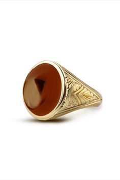 A beautiful signet ring with carvings on the sides made by hand and Carnelian gemstone in the center. *real images of the ring, taken by us* Carnelian Stone Size: 14x12mm Material: - Sterling Silver 925 - 9K Gold (375) - 14K Gold (585) - 18K Gold (750) *All signet rings are hallmarked on the back for certification* We offer FREE Worldwide DHL & FedEx Shipping! - Branded DanelianJewelry Gift Box with each order! Classic Carnelian Signet Ring With Polished Finish, Classic Carnelian Signet Ring For Formal Occasions, Classic Carnelian Signet Ring For Formal Events, Classic Carnelian Signet Ring For Anniversary, Antique Carnelian Intaglio Rings, Classic Carnelian Jewelry For Anniversary, Formal Carnelian Signet Ring With Polished Finish, Yellow Gold Carnelian Jewelry With Polished Finish, Red Oval Intaglio Ring