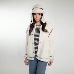 Stay stylish and snug this autumn and winter with our newest addition, the Dannika Trapper Hat. Perfectly matching our beloved Dannika Gilet, this hat is designed for the modern woman who values both fashion and comfort. Available in elegant Cream and classic Black, the Dannika Trapper Hat is your go-to accessory for those chilly days. Crafted with premium materials, this hat ensures warmth without compromising on style. The soft lining and chic design make it a must-have for your winter wardrobe. Whether you’re heading out for a brisk walk or a cozy coffee date, the Dannika Trapper Hat will keep you looking fabulous and feeling comfortable. 100% Polyester Dry Clean Casual Winter Hats With Fleece Lining, Casual Cold Weather Hats With Fleece Lining, Casual Hooded Winter Hat, Warm Hooded Fall Hat, Cozy Adjustable Winter Bonnet, Casual Warm Hooded Hats, Cream Hats For Cold Weather In Fall, One Size Hat For Winter Cold Weather, Cozy Hats With Fleece Lining For Fall