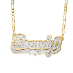 Gift yourself or someone special with this unique name necklace. Fashioned in sleek sterling silver and 24K gold plating, this three-dimensional design spells out her name, 3 to 10 characters in length, in a stylish hammered font. Beneath the name, a similarly textured heart and ribbon accent completes the look. The design is centered along an 18.0-inch figaro chain that secures with a lobster claw clasp. Anniversary White Gold Nameplate Necklace, Engraved Custom Nameplate Necklace For Anniversary, Custom Gold Necklace With Name On Heart Pendant, Gold Custom Nameplate Necklace For Valentine's Day, Custom White Nameplate Necklace, Anniversary Engraved Nameplate Necklace, Gold Double Heart Name Necklace, Gold Nameplate Jewelry With Names, White Nameplate Necklace For Anniversary