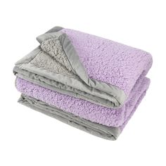 three blankets stacked on top of each other in purple and grey colors, with one blanket folded