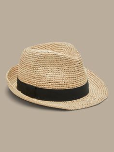 Known as a "shortie", this timeless straw fedora is crafted with a narrow brim and classic grosgrain band detail.  Adjustable drawstring inside the band creates a perfect, custom fit.  Interior circumference: Small 22", Medium 23", Large 24" Brim: 1. Straw Fedora, The Band, Panama Hat, Custom Fit, Fedora, Banana Republic, Straw, Band, Hats