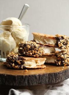 some cookies and ice cream are on a wooden board