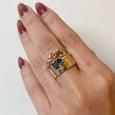 Designed as a piece of the Bricolage series by WWAKE, which showcases the interesting juxtaposition of eclectic shapes, sizes, and colors, this new ring is one of our all-time favorites. This one-of-a-kind version features a geometric teal green emerald sapphire paired with a pair cut sapphire of similar coloring while being set against a dainty round white diamond for a coy play between shape and color that feels modern and impossibly balanced. It's a statement on its own, but also stacks beaut Engagement Style, Baguette Cut, Pear Cut, Baguette Cut Diamond, Recycled Gold, Emerald Cut, Teal Green, White Diamond, Gemstone Colors