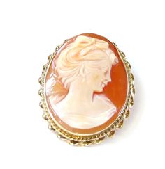 "14K Yellow Gold Cameo Brooch / Pendant Lady Portrait Pin and Pendant Carved Shell Caramel color background No scratches or cracks to note Measures approx: 1-1/4\" tall X 1\" Wide or 3.4 cm x 2.7 cm - with frame Cameo measures: 1-1/4\" X 7/8\" or 3 cm X 2.2 cm Fastens with Safety clasp or rollover clasp in good working condition Total Weight 7.4 Grams 110916-4320 gemsoft 02006 FEEL FREE TO MESSAGE ME IF YOU HAVE ANY QUESTIONS OR WISH TO SEE MORE PICTURES * Back to Shop Watch and Wares? https://w Luxury Oval Cameo Brooch, Classic Oval Brooches, Oval Brooches For Formal Occasions, Collectible Cabochon Brooches, Classic Oval Cameo Brooch, Classic Oval Cabochon Brooches, Anniversary Oval Brooches, Oval Cameo Brooch For Anniversary, Classic Oval Brooches For Collectors