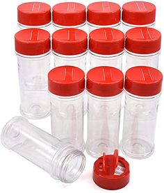 twelve plastic bottles with lids and red caps