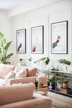 a living room filled with furniture and plants