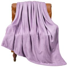 a chair with a purple blanket draped over it