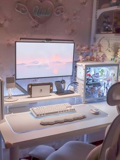 a computer desk with a keyboard, mouse and monitor