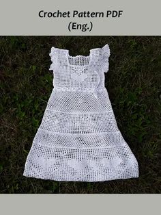 a white crochet dress laying on top of grass with the words crochet pattern