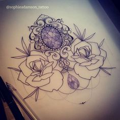 a drawing of some flowers on a sheet of paper with an intricate design in the middle