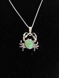 "Green opal crab jewelry/southwestern jewelry design /handmade design /crab necklaces /oceanography /.925 sterling silver/ crab pendant lab created opals Stone size: 8mm Chain lengths: 18\" or 20\"" Nickel-free Opal Necklaces As Gift, Nickel-free Opal Necklace Gift, Opal Cabochon Jewelry Gift, Opal Cabochon Jewelry For Gift, Opal Round Pendant Jewelry For Gifts, Opal Pendant Necklace Gift, Opal Round Pendant Jewelry Gift, Round Pendant Jewelry With Lobster Clasp As Gift, Opal Pendant Necklace For A Gift