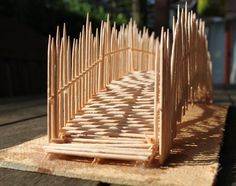 a wooden structure sitting on top of a table