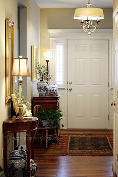 the hallway is clean and ready to be used as an entrance way for someone's home