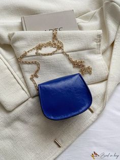 BirdinBag - Neon Blue Mini Flap Chain Saddle Bag - Compact and Stylish Blue Pouch Box Bag For Mobile Phone, Blue Mobile Phone Pouch Box Bag, Chic Blue Mobile Phone Box Bag, Everyday Blue Mobile Phone Box Bag, Elegant Blue Bag With Chain Detail, Blue Shoulder Bag With Mobile Phone Pocket For Party, Blue Party Shoulder Bag With Mobile Phone Holder, Blue Evening Bag With Chain Detail, Blue Crossbody Evening Bag As Gift