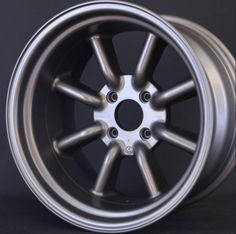 an aluminum wheel on a black background