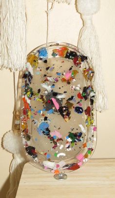 a plate that has been decorated with confetti and tassels