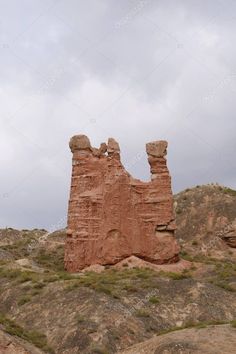 an old rock formation in the desert under a cloudy sky stock photo 547982