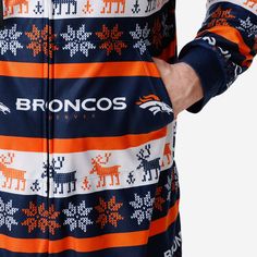 These Denver Broncos Ugly Short One Piece Pajamas will keep you bundled up and oh, so comfortable while making sure your legs don't overheat. Balanced, as all things should be. Features Onesie with zipper closure to keep you comfy while you cheer on the team All-over team-colored design so you can rep the team in style Team logo displays throughout, in case there were any doubts where your allegiances lie Repeat winter-themed pattern throughout that will have you feeling like you're in a winter Short One Piece, Short Pant, Long Sleeve And Shorts, One Piece Pajamas, Winter Themed, Denver Broncos, Winter Theme, The Team, Team Spirit