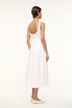 The Wells Dress features a corset-style panel construction to create a flattering, fitted shape through the waist and a midi length a-line skirt. Made out of lightweight cotton poplin. Elegant Cotton Dress With Corset Back, Elegant Cotton Dresses With Corset Back, Cotton Midi Dress With Ruched Fitted Bodice, Elegant Cotton Corset Dress With Fitted Bodice, White Cotton Dress With Corset Back, Chic Cotton Corset Dress With Fitted Bodice, Elegant Cotton Midi Dress With Ruched Bodice, Elegant Square Neck Cotton Corset Dress, Elegant White Cotton Corset Dress