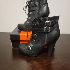 Brand New, Never Worn, Black Heeled, Combat Bootie Edgy Fall Heels With Round Toe, Fall High Heel Booties With Buckle Closure, Edgy Closed Toe Lace-up Boots For Fall, Edgy Ankle-high Faux Leather Heels, Ankle-high Synthetic Edgy Heels, Edgy Winter Heels With Buckle Closure, Edgy Ankle-high Heels For Fall, Edgy Closed Toe Heels For Fall, Edgy Lace-up Faux Leather Heels