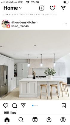 a kitchen with white cabinets and an island in the middle is featured on instagram