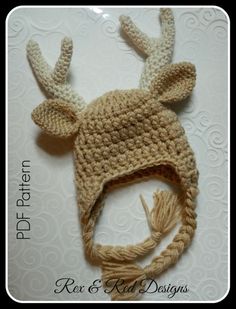 a crocheted deer hat with antlers on it