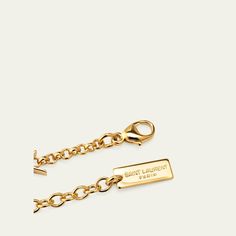 Saint Laurent chain bracelet Shiny brass with a gold-tone finish Features signature YSL logo stations Adjustable length Lobster clasp Imported Gold-tone Plated Jewelry With Logo Plaque, Yellow Gold Chain Link Jewelry With Gold-tone Logo, Yellow Gold Metal Jewelry With Gold-tone Logo, Gold-tone Metal Jewelry With Logo Plaque, Elegant Gold-tone Chain Link Jewelry With Logo Plaque, Elegant Gold-tone Chain Link Jewelry, Designer Gold Jewelry With Gold-tone Hardware, Luxury Gold-tone Jewelry With Logo Charm, Gold-tone Metal Jewelry With Logo Charm