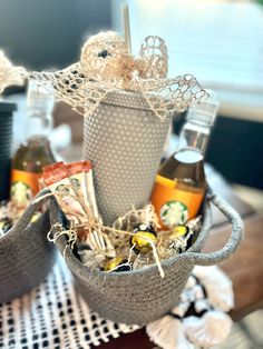 a cup filled with drinks sitting on top of a table