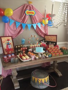 a circus themed birthday party with balloons and cake