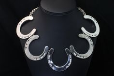 "I bet you'll be able to summon up Ole Lady Luck when you wear our handmade sterling silver Lucky Horseshoe necklace! Yes its substantial, weighing in at 4.89 ounces! But think of the heads that will turn! Powerful statement, trust in your Luck! Horseshoes and clasp made by us! 20\" long, this necklaces' equine related components were hand carved by us, cast by us, polished and made into this necklace by us, and brought to you, by us! Free shipping in the USA!" Lady Luck, Horseshoe Necklace, Lucky Horseshoe, Hippie Necklace, Bib Necklaces, Unisex Ring, Photo Bracelet, Vintage Bracelets, Over The Top