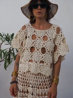 We hand source antique and vinagre crochet & lace textiles and up-cycle it here in Ibiza in to unique on off a kind garment. Due to the nature there could be some imperfections but we do our best to only recycle mint condition textiles. Really nice quality antique lace work in silk threads. Size is medium Condition is perfect Cream Lace Top For Beach, Cream Lace Top For The Beach, Bohemian Lace Crochet Top With Open Knit, Summer Crochet Top With Cotton Lace Work, Summer Crochet Lace Top With Crochet Trim, Beige Crochet Lace Dress For Festival, Cream Bohemian Lace Top For Beach, Bohemian Summer Lace Top, Bohemian Lace Top With Lace Trim For Vacation