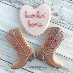 two cookies shaped like boots with the words knockin'boots written on them