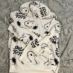 Medium Sized Black And White Snoopy Hoodie Never Been Used But It Does Have A Light Stain On The Back. Snoopy Hoodie, Oversized White Hoodie With Cartoon Print, White Oversized Hoodie With Cartoon Print, White Casual Hoodie With Cartoon Print, Casual White Hoodie With Cartoon Print, White Sporty Sweatshirt With Cartoon Print, Snoopy Clothes, Retro Hoodies, Light Blue Sweatshirt