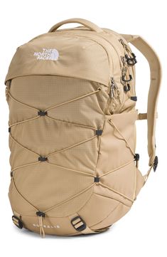 The FlexVent suspension system and padded back panel in this water-repellent backpack ensure lasting comfort whether you're on the trail or on campus. The convenient sternum strap offers added support, and the front bungee straps can secure a jacket. Two exterior side pockets provide handy storage for water bottles and small items, while the spacious main compartment is organized for your laptop, books and other daily essentials. Top carry handles; padded shoulder straps; sternum strap   FlexVen North Face Borealis Backpack, Borealis Backpack, The North Face Borealis, North Face Borealis, Bungee Cord, Tablet Sleeve, Canvas Backpack, North Face Backpack, North Face Women