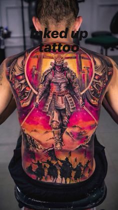 the back of a man's body with tattoos on it and an image of a warrior