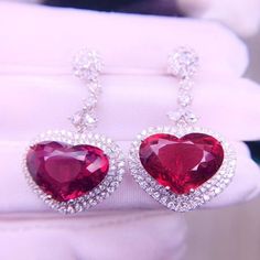 16.8ct Rare Natural Rubellite Earrings, Heart Shaped Red Tourmaline Drop Earrings with Real Diamonds, 18K solid White Gold, with CertificateA Pair of Stunning 18k White Gold earrings set with 16.85ct natural red rubellite. Excellent fire and brilliance. The color of the Rubellite is a fiery vivid red which is ultra rare and highly valued. This precious gem is surrounded with REAL diamonds. This pair of earrings is a wonderful piece of craftsmanship and one of a kind. Gemstone: Natural Rubellite Luxury Red Heart Cut Jewelry, Luxury Red Heart-cut Jewelry, Luxury Heart Cut Ruby Jewelry, Elegant Red Heart-shaped Earrings, Luxury Heart Earrings For Wedding On Valentine's Day, Luxury Heart Earrings For Valentine's Day Wedding, Formal Fine Jewelry Heart Earrings With Gemstone, Elegant Red Heart Earrings For Formal Occasions, Elegant Red Heart Earrings For Formal Events