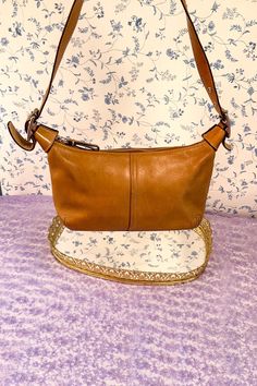 Coach Demi Legacy Hobo in Camel Leather (Style Number #9564) Mini but full of vintage Coach charm! This miniature Hobo bag packs a lot of style in its' small frame. Bag is in overall good condition--there is some exterior staining that should lighten with further cleaning. Hardware is in tact and in good condition, interior is pretty clean, exterior leather doesn't have rips, zippers still work, etc. See photos for details. Bag is 9 inches across, 5 inches tall (not including strap), and has a i Bag Packs, Vintage Coach Bags, Best Purses, Brown Leather Handbags, Hobo Bags, Frame Bag, Vintage Soft, Leather Style, Small Frame