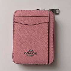 Color: Silver/ Flower Pink Product Details: Smooth Leather Two Credit Card Slots Id Window Open Pockets Zip Compartment Chain Wrist Strap With Dogleash Clip Attached 3" (L) 4 1/4" (H) 3/4" (W) Style No. 6303 Tag Is Included Coach Coin Purse With Card Slots For Everyday Use, Coach Travel Card Holder With Rfid Blocking, Coach Leather Card Holder For Everyday Use, Coach Travel Coin Purse With Interior Card Slots, Pink Rfid Blocking Bags, Coach Travel Coin Purse With Card Slots, Coach Rfid Blocking Card Holder For Travel, Coach Travel Card Holder, Elegant Pink Card Holder For Travel