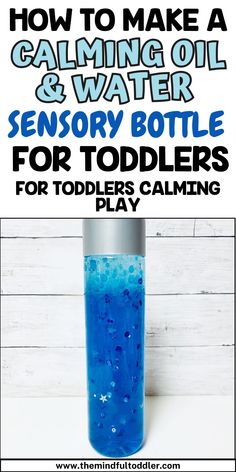 a bottle filled with blue liquid and the words how to make a calming oil and water sensory bottle for toddlers play