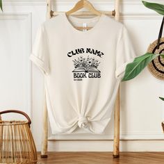 Custom Book Club T-shirt | Personalized Reading Club T-shirt | Bookish Gift | Book Lover T-shirt | Bookworm Tee | Design Your Own T-shirt Sizing and Color Guidelines 📏🎨 We use Comfort Colors Heavyweight brand t-shirts for all listings that mention Comfort Colors in the title. The shirts are Unisex and designed to be loose-fitting. If you prefer a tighter fit, we recommend ordering one size smaller. Each shirt is meticulously crafted to your specifications, making returns or exchanges impractic Belle’s Book Club Shirt, Belles Book Club Shirt, Cheap White Bookish T-shirt, Relaxed Fit Pre-shrunk Bookish T-shirt, Bookish Cotton T-shirt With Custom Print, Reading Club, Custom Book, Bookish Gifts, Tee Design