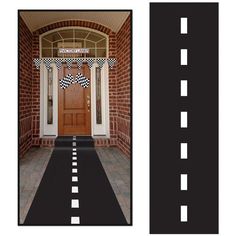 the front door is decorated with black and white checkerboard stripes, along with an entrance mat