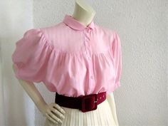 70s-80s pink blouse, puffy sleeve elegant blouse, checkered jacquard blouse, peter pan collar, folk style blouse, sheer-ish statement blouse. Measurements laying flat : shoulders :38 cm (15 inches) bust :63cm (25 inches) total lenght :63 cm (25 inches) sleeve lenght :33cm (13 inches) Pink Peter Pan Collar Top For Spring, Pink Blouse With Peter Pan Collar For Spring, Pink Peter Pan Collar Blouse For Spring, Pink Doll Collar Blouse For Spring, Pink Blouse With Doll Collar For Spring, Pink Puff Sleeve Blouse With Ruffles, Pink Ruffled Puff Sleeve Blouse, Fitted Retro Pink Blouse, Vintage Pink Blouse For Daywear