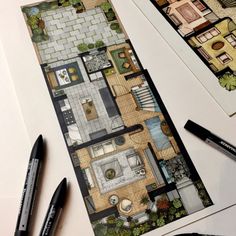 the floor plan for a small house is shown with markers and pencils next to it