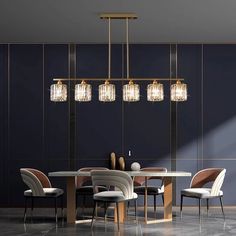 a dining room table with four chairs and a chandelier hanging from the ceiling