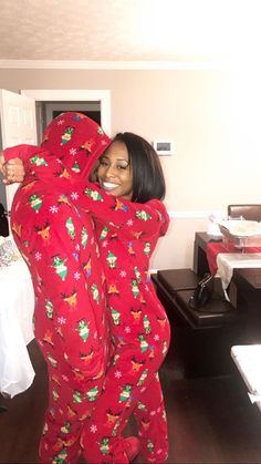 a woman in red and green christmas pajamas