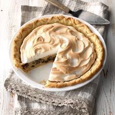 a pie sitting on top of a white plate