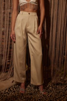 Your spring fit just got that much better thanks to the Jaxon Cream Trousers. Wear from work to happy hour, these pants are easily dressed up or down. Style with your favorite crop, our Isla Straw Fedora, a pair of strappy sandals, and you're set for the entire day! PRODUCT DESCRIPTION AND MATERIALS: - cream wide leg trousers - pleated - button closure - functional front pockets - non-functional welt back pockets - high waisted fit - finished hem - 100% lyocell - dry clean only SIZE RECOMMENDATI Casual Pants For Night Out In Spring, Casual Pants With Pockets For Date Night, Business Casual Wide Leg Ankle-length Pants For Spring, Straight Leg Dress Pants For Spring Day Out, Straight Leg Dress Pants For Day Out In Spring, Summer Tapered Leg Pants For Night Out, Casual Beige Bottoms For Date Night, Spring Date Night Pants With Pockets, Relaxed Fit Chic Dress Pants For Spring