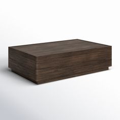 a wooden box sitting on top of a white surface